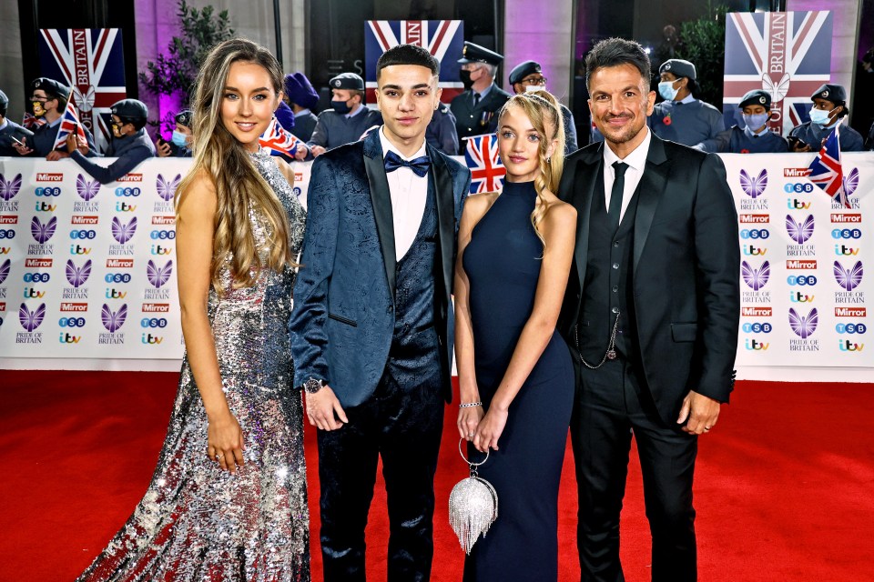 Emily and Peter pose with Princess and Junior, his two children from his marriage to Katie Price