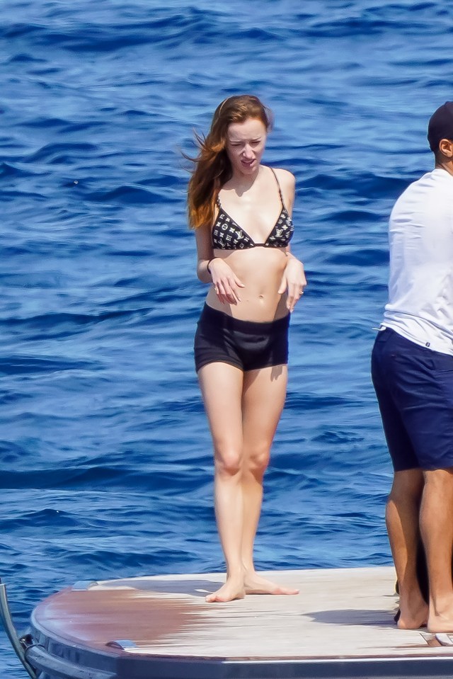 The actress paired her patterned swim top with denim shorts