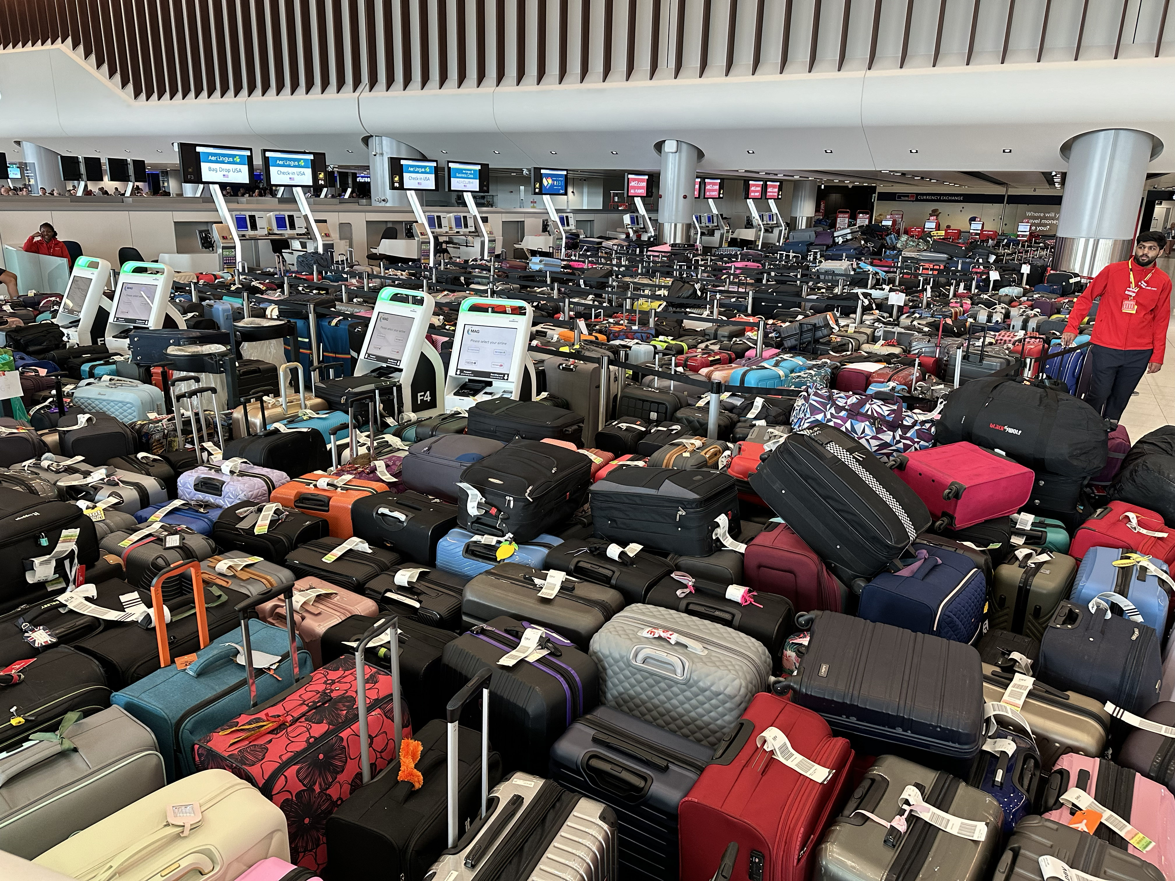 Picking a quieter airport could help avoid the chaos that saw these hundreds of bags abandoned at Manchester airport