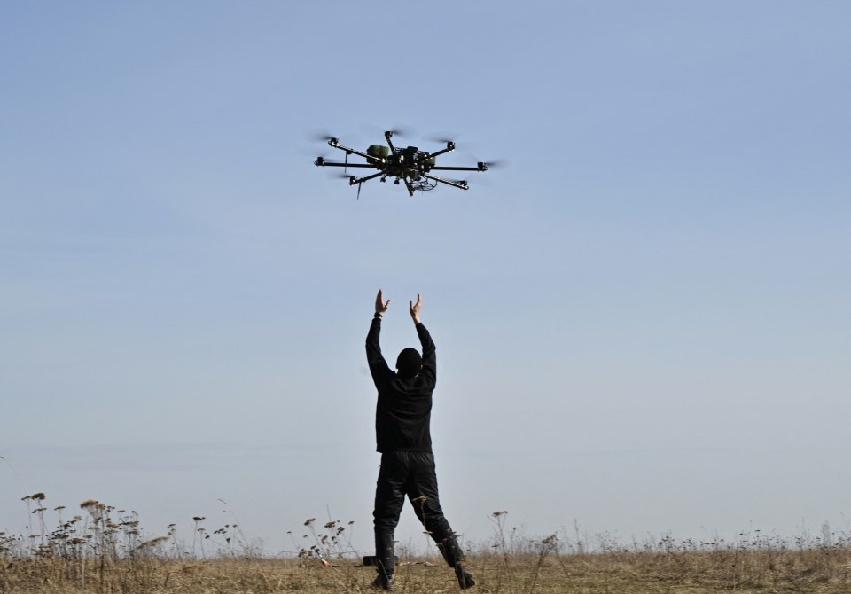 A pilot practices with a drone on a training ground in Kyiv region