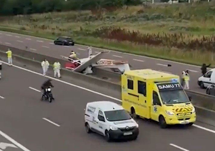 Horror footage showed emergency services rushing around the upturned aircraft