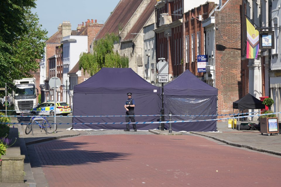 Police outside of the Dolphin and Anchor Wetherspoons on West Street where tents were put up at the scene