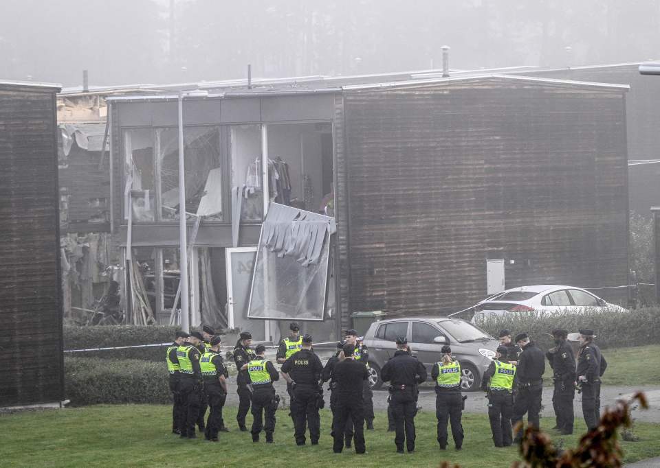 Police at the scene of a bomb attack ordered by warring crimelords