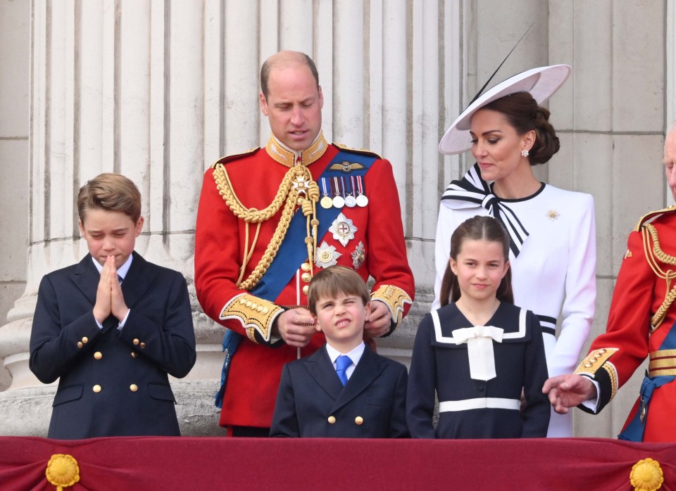 Kate looks at her family fondly on the balcony