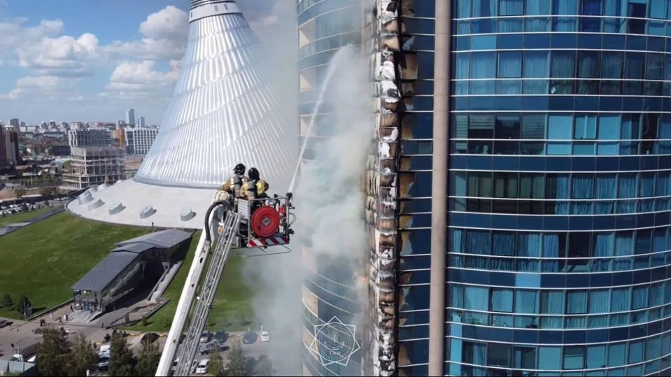 Firefighters are seen working to extinguish the blaze