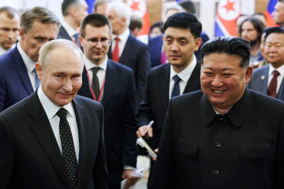 a group of men in suits and ties are walking together