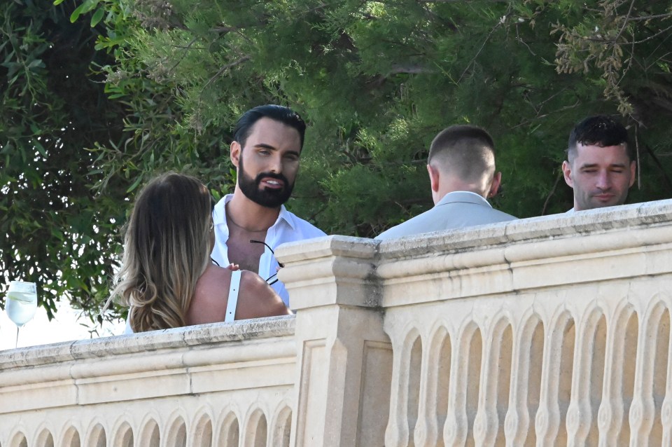 Rylan looked dapper in an open white shirt