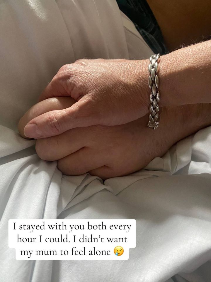 Sharon holding her husband's hand while he was in hospital for cancer treatment