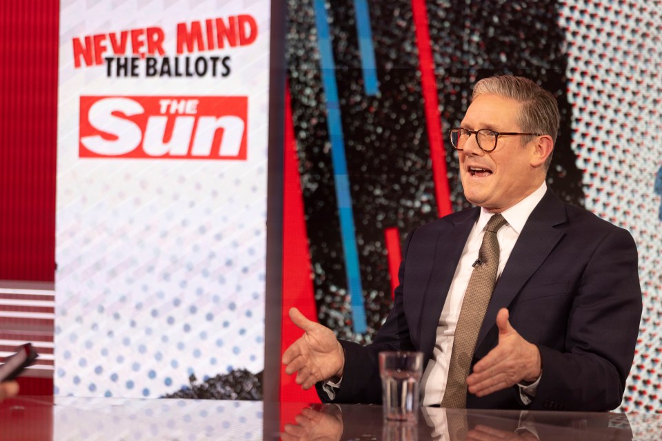 a man in front of a sign that says never mind the ballots