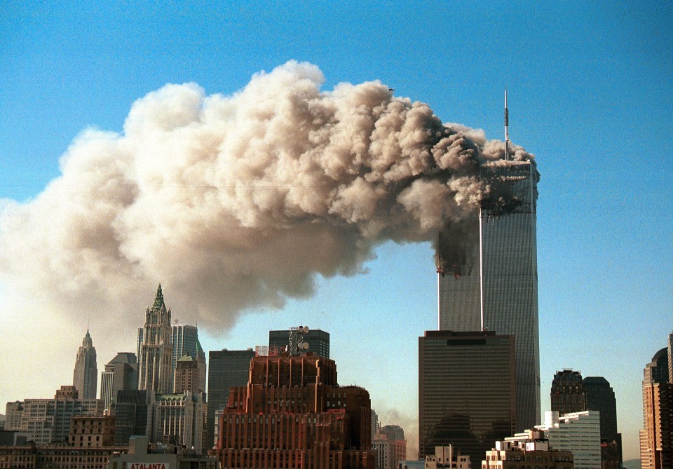 Smoke pours from the twin towers of the World Trade Center after they were hit by two hijacked airliners on 9/11