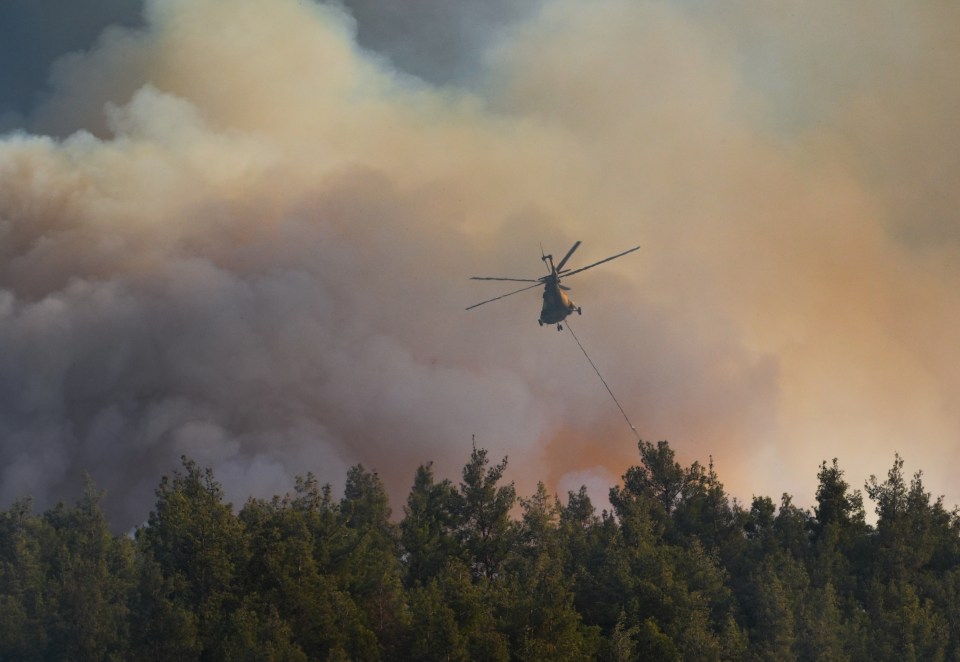 Authorities worked to extinguish the flames with helicopters