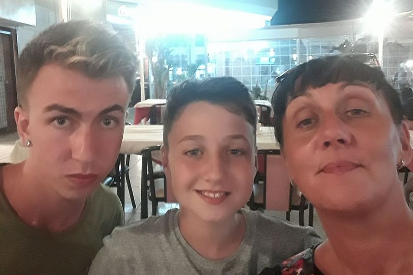 Jay (centre) pictured with his mum and brother when he was younger