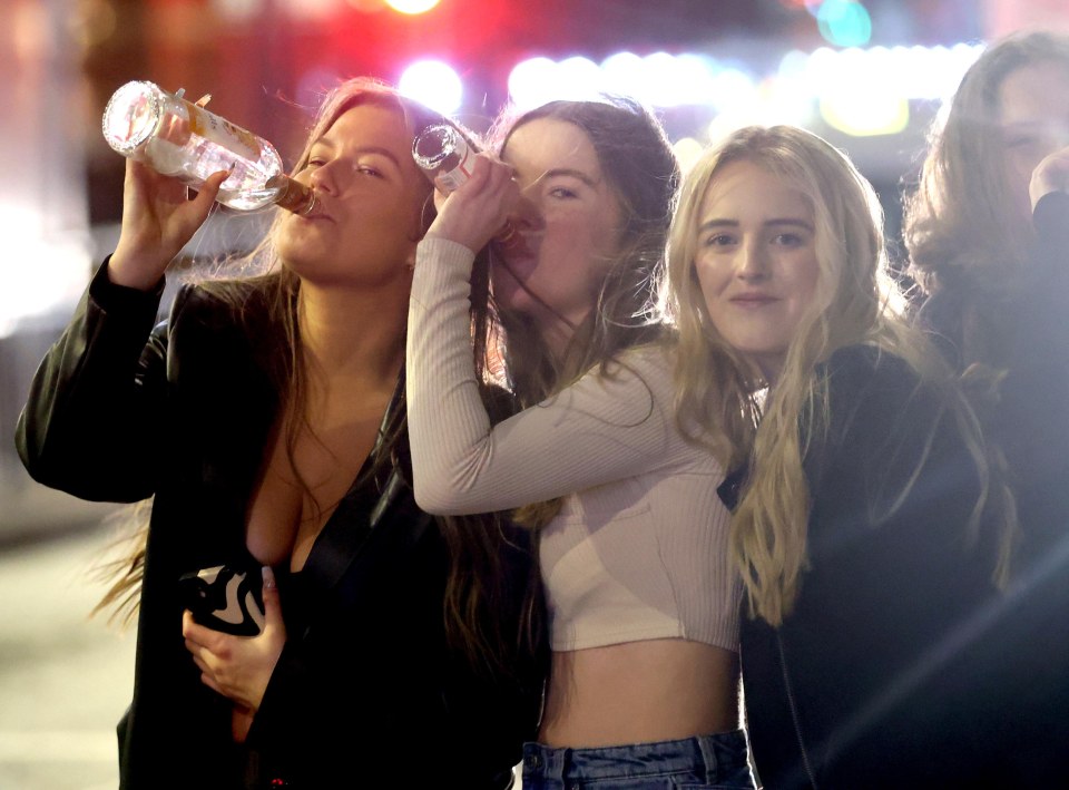 Three partygoers lapping up the nightlife on Duncan Street