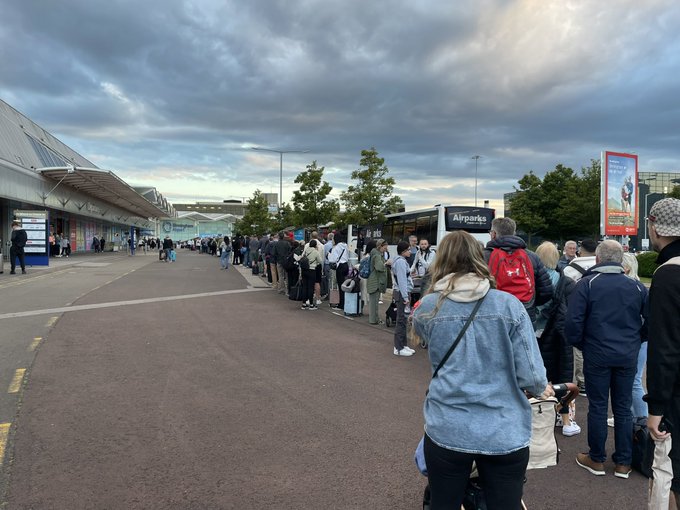 Brits were stuck in huge queues at Birmingham Airport today