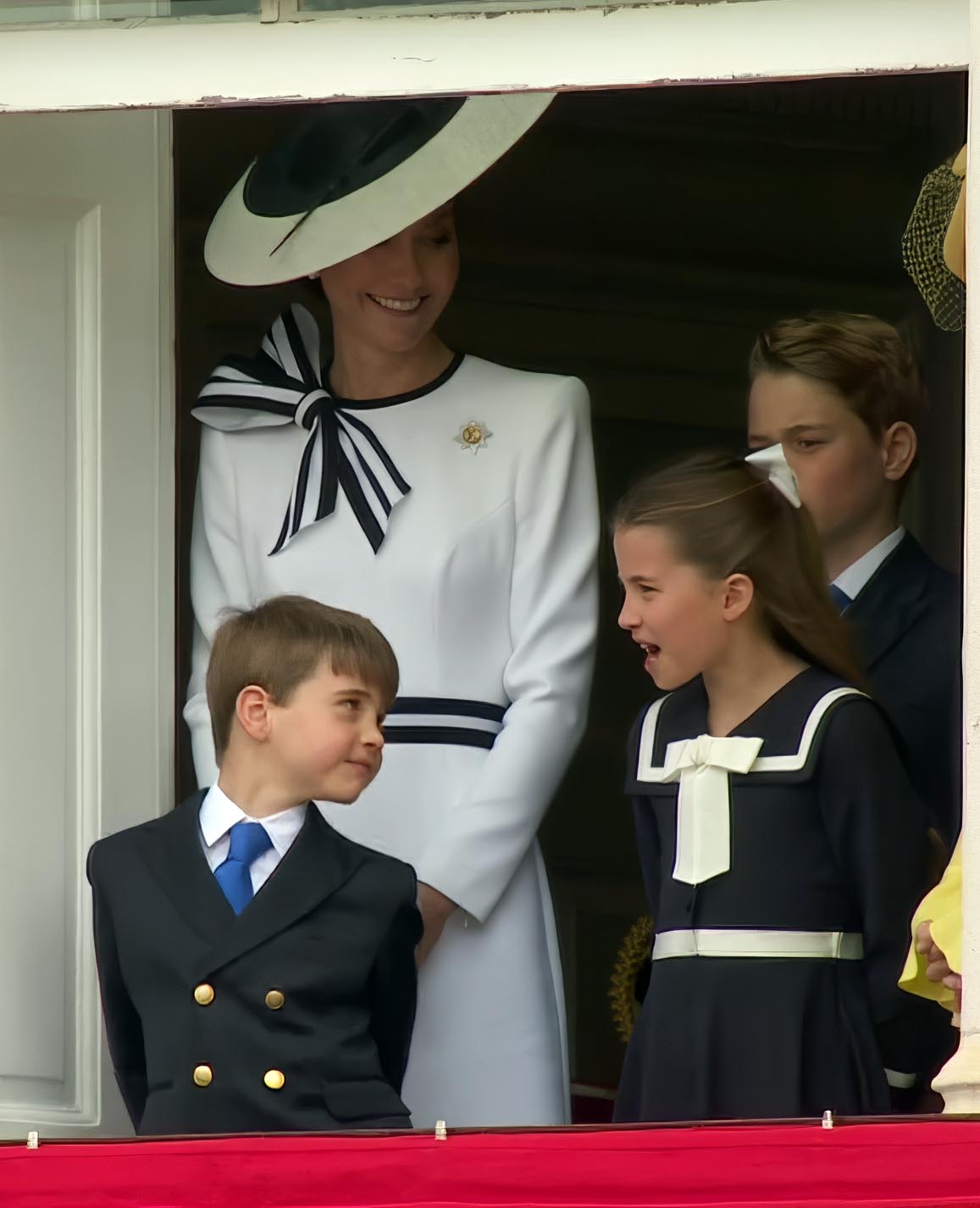 Prince Louis dancing on the balcony