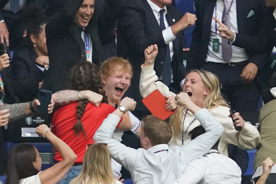 a man in a white shirt with the word champions on it