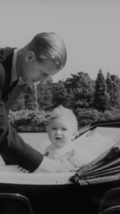 A heartwarming photograph of King Charles as a baby with Prince Philip