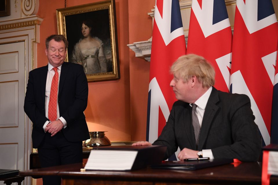 David Frost looks on as ex-PM Boris Johnson signs the EU-UK Trade and Cooperation Agreement