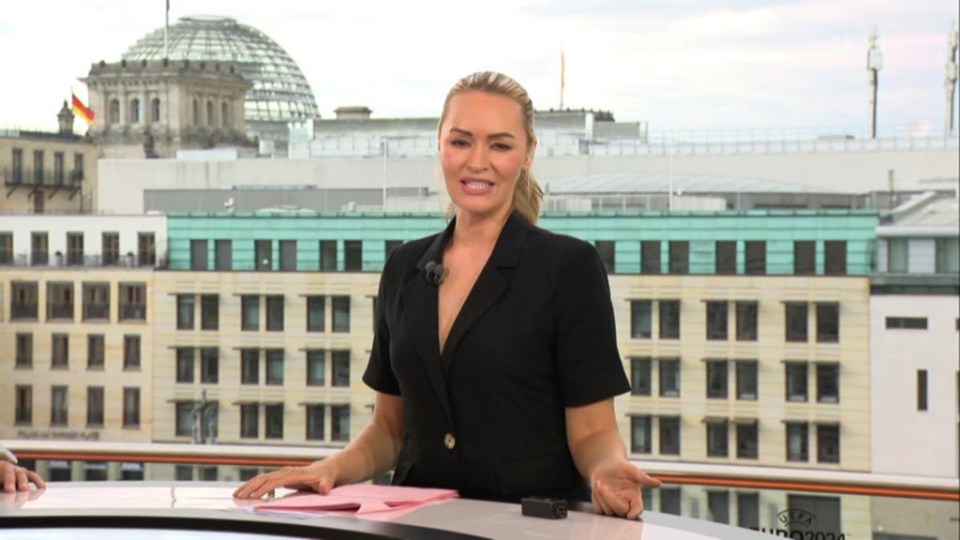 Laura Woods looked stunning in a black plunge top on ITV's Euro 2024 coverage