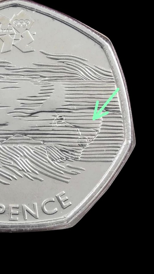 The rare coin features lines on the swimmer's face