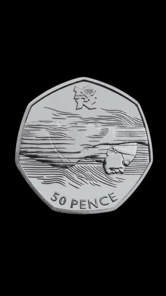 The coin in circulation has no lines on the swimmer's face