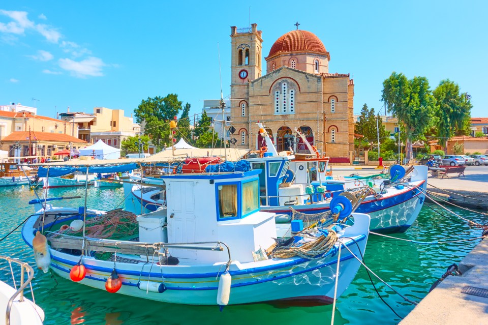 The colourful waterfront and traditional church in Aegina