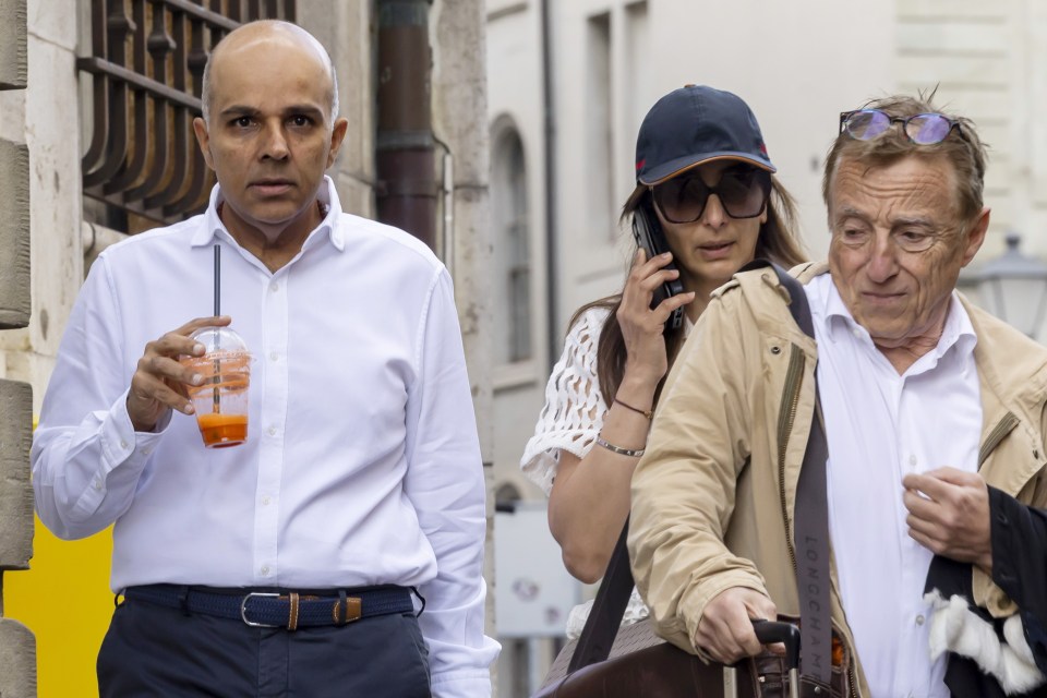 Ajay Hinduja (L) and his wife Namrata arrive with their lawyer Robert Assael, June 10