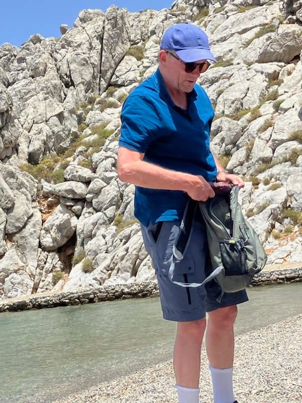 The dad-of-four is pictured on the Greek beach before he disappeared