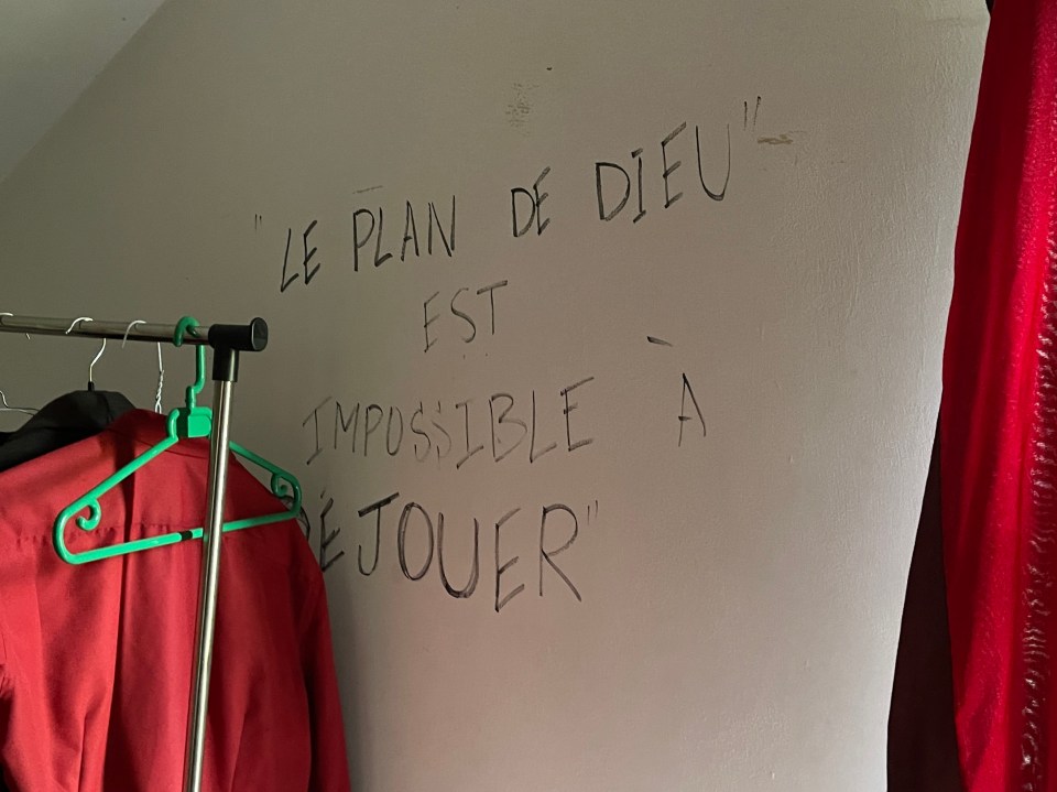 Scribbled across the a bedroom wall was 'God's plan is impossible to foil' in French