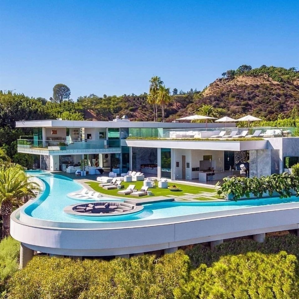 an aerial view of a large house with a swimming pool