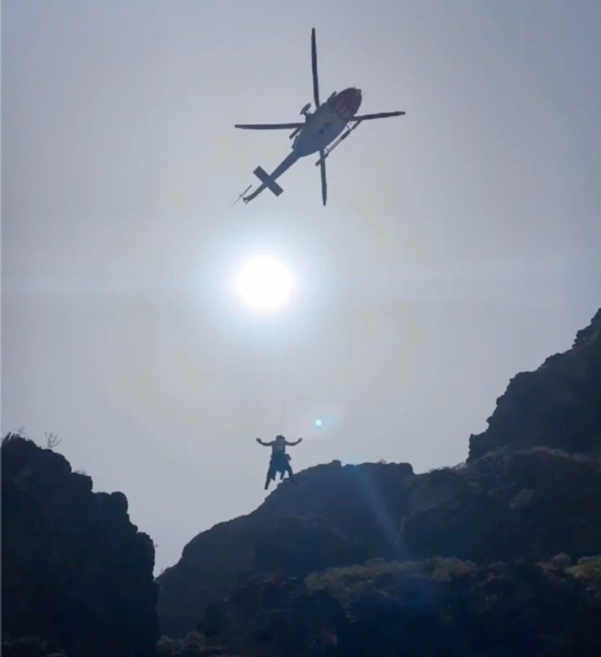 The moment rescue workers perform a helicopter airlift in the area where a body was found in the hunt for Jay