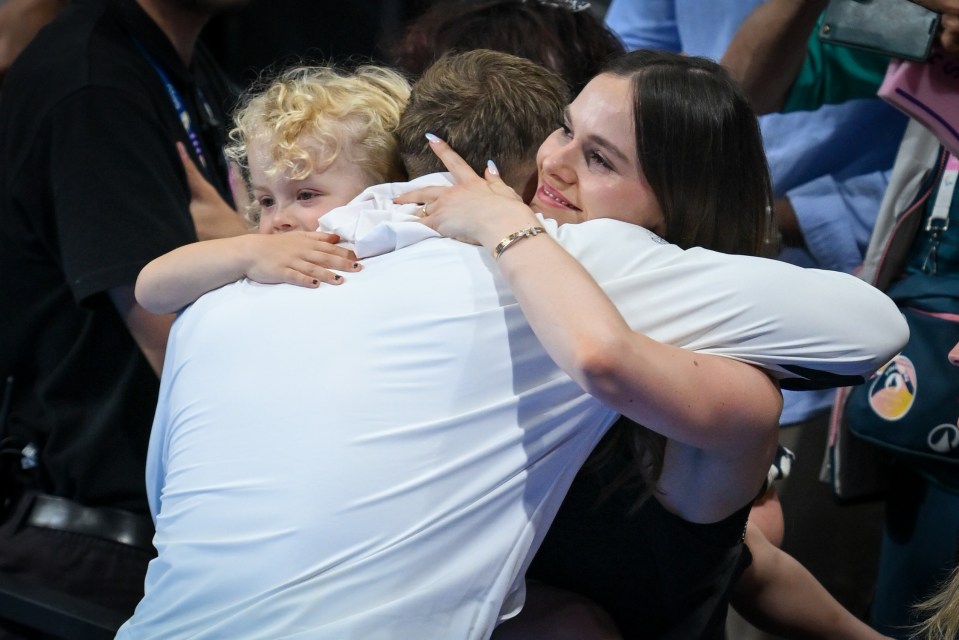 The three embraced in a heartwarming moment