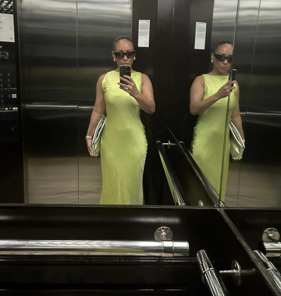 The musician showed off her trim figure in a satin green dress in Dubai