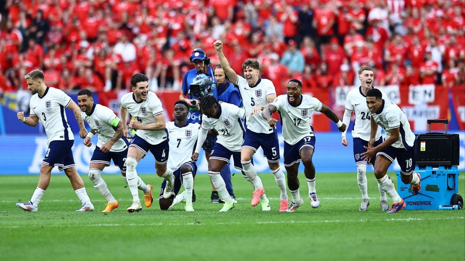 a group of soccer players on a field with one wearing the number 7