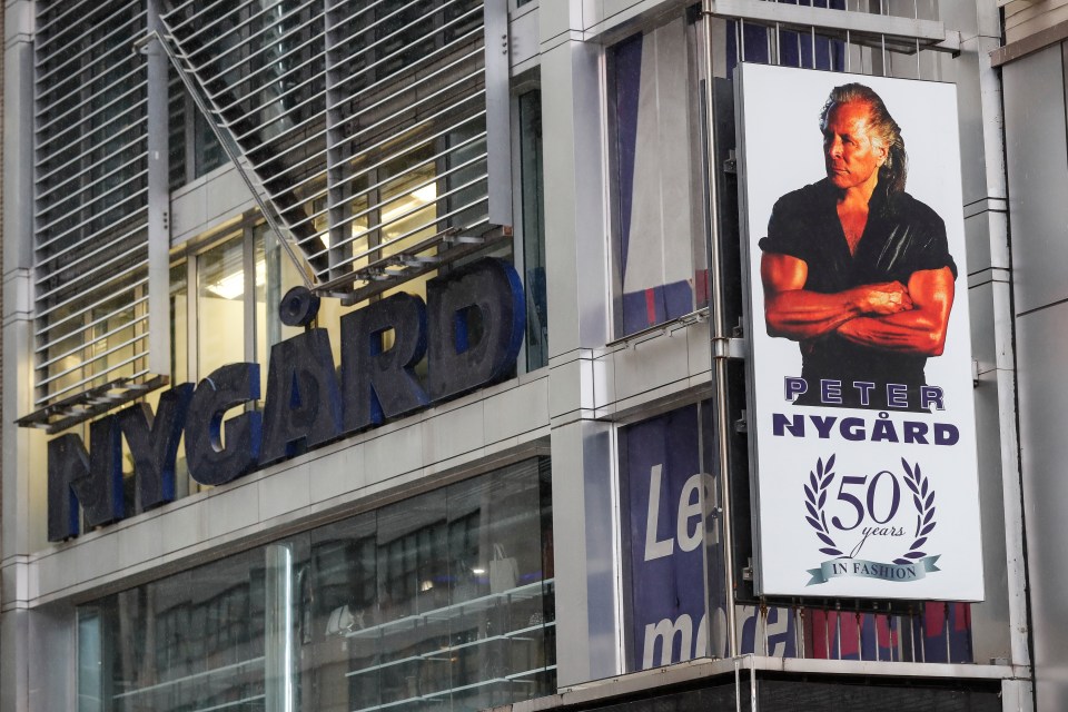 A sign bearing the likeness of Nygard is displayed outside his Times Square headquarters in 2020