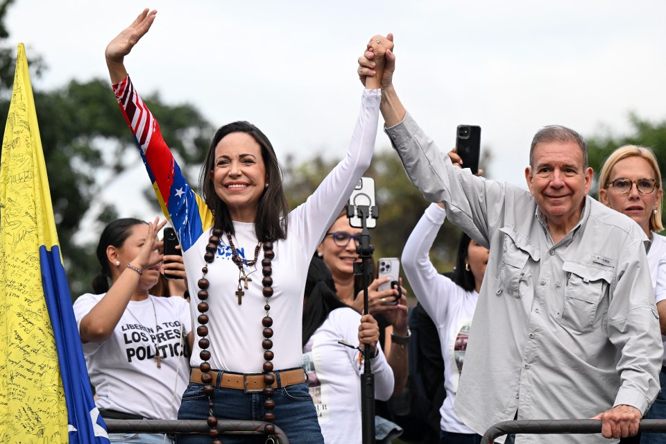 Venezuelan opposition presidential candidate Edmundo Gonzalez Urrutia (R) and opposition leader Maria Corina Machado (L)