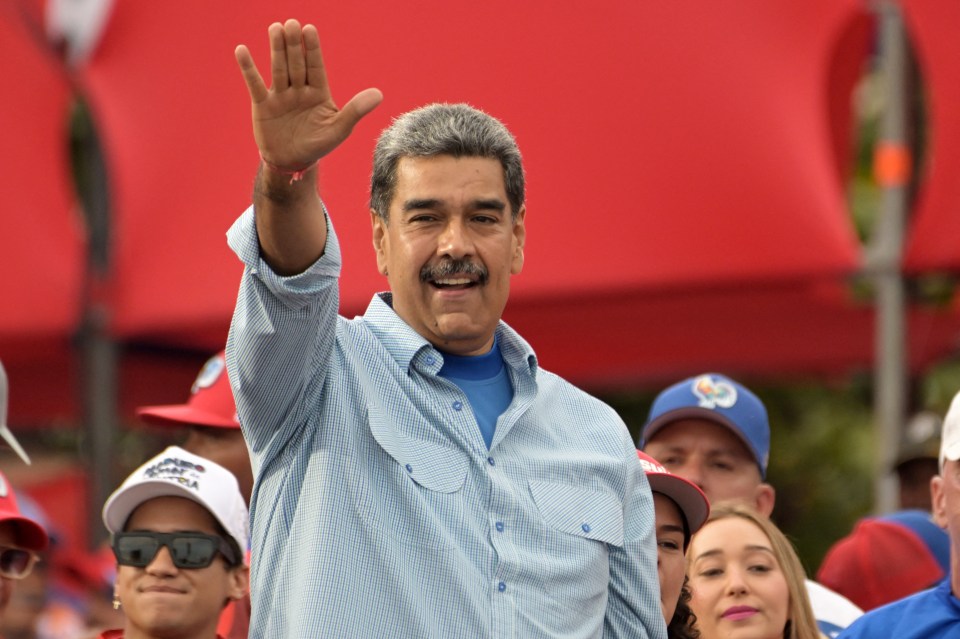 Venezuelan President and presidential candidate Nicolas Maduro greets supporters