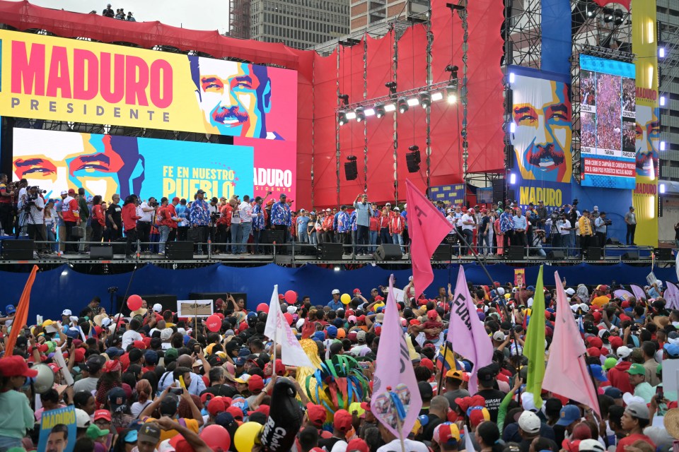 Supporters of Maduro attend his campaign closing rally in Caracas on Thursday