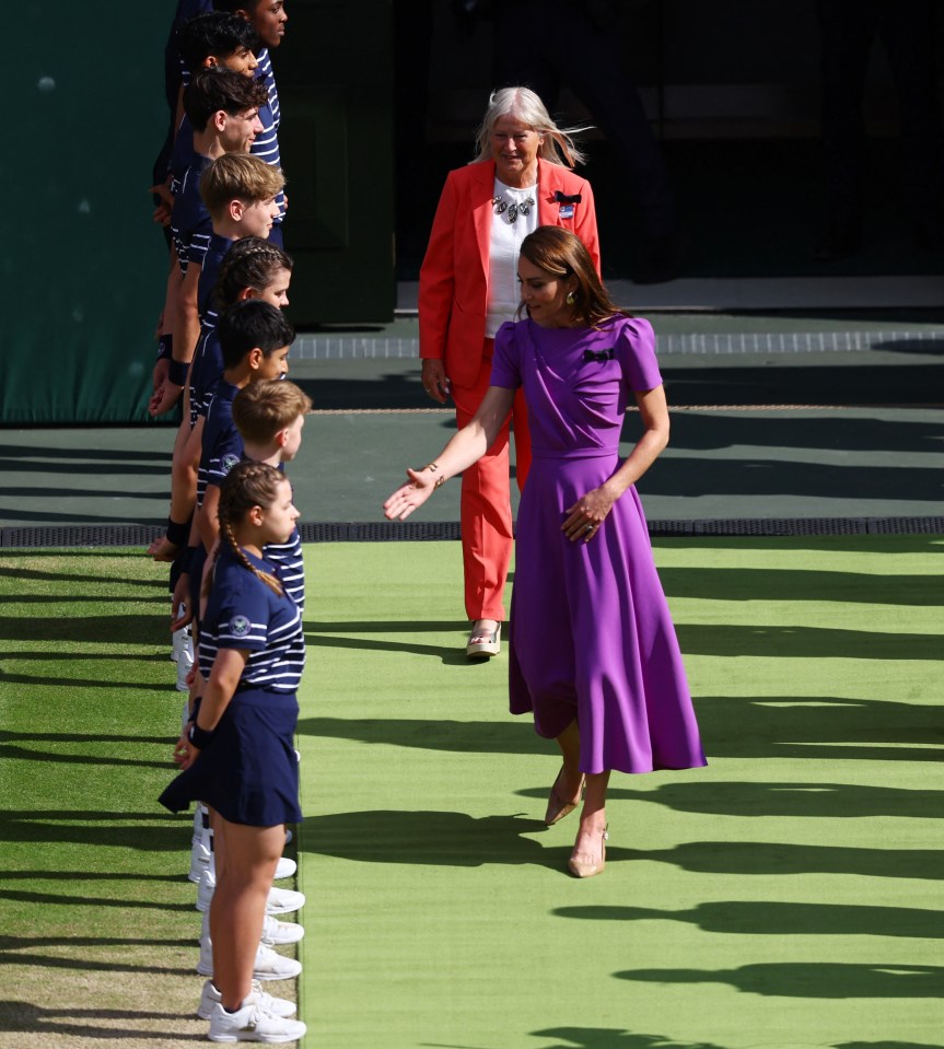 The Princess also walked through a line of ball boys and ball girls, stopping to talk to them, before awarding the trophies