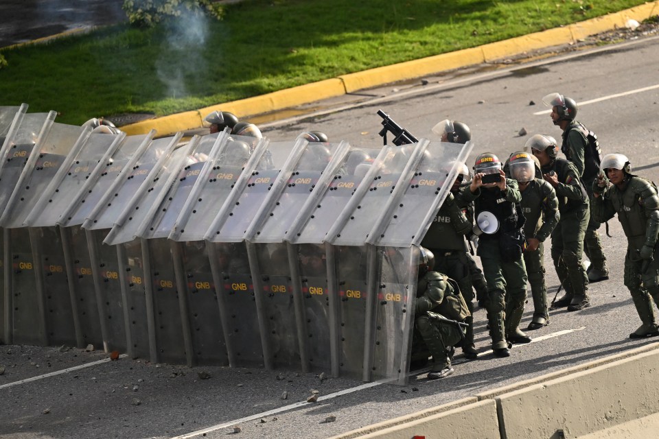 National Guardsmen take formation against protesters