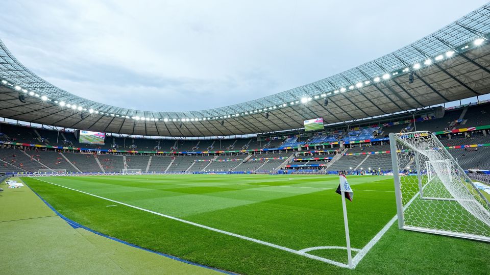 an empty soccer stadium with a scoreboard that says ' uruguay ' on it