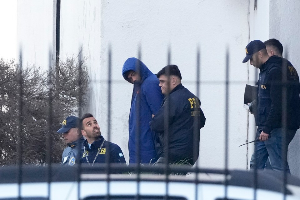 Auradou being led away by Argentinian cops in handcuffs after being arrested over the claims