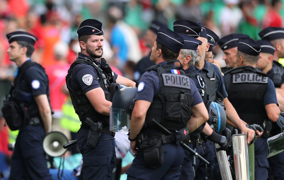 Police officers were seen on the pitch after the pitch invasion