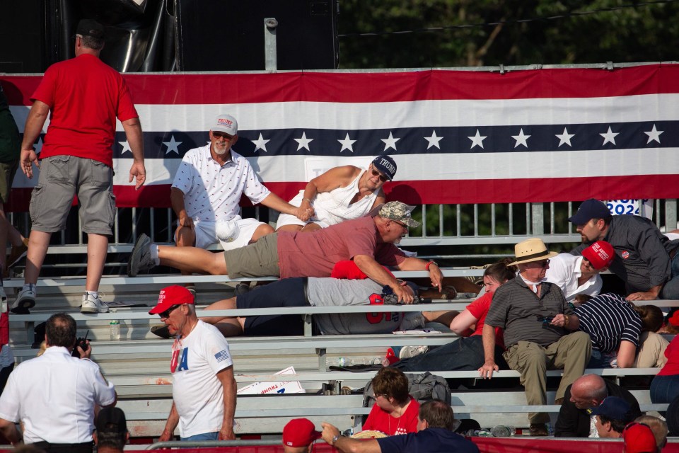 Supporters in the crowd ducked for cover in the stands