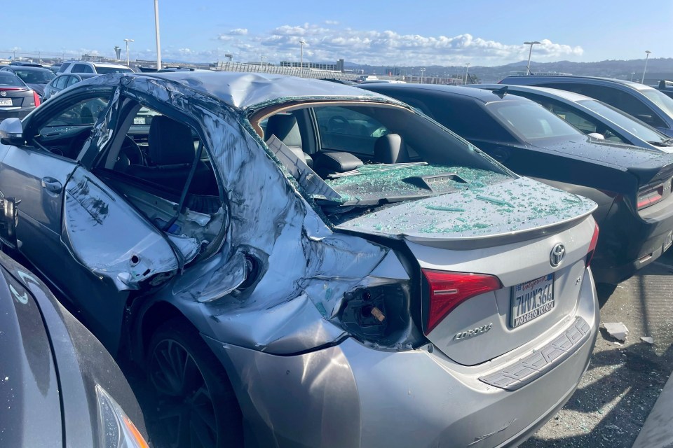 A picture of the car crushed by the tyre after it fell from the Boeing 777 jet in March