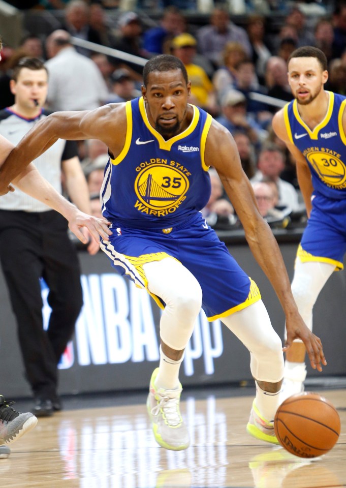 golden state warriors player number 35 dribbles the ball