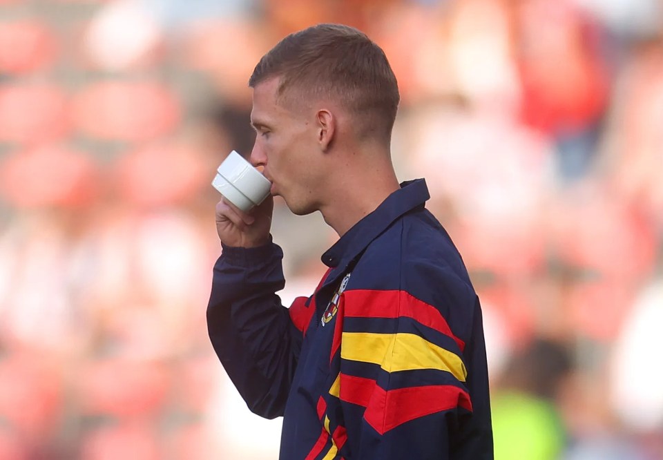 The ace had a cup of tea before kick-off... even though the cup appeared to be empty