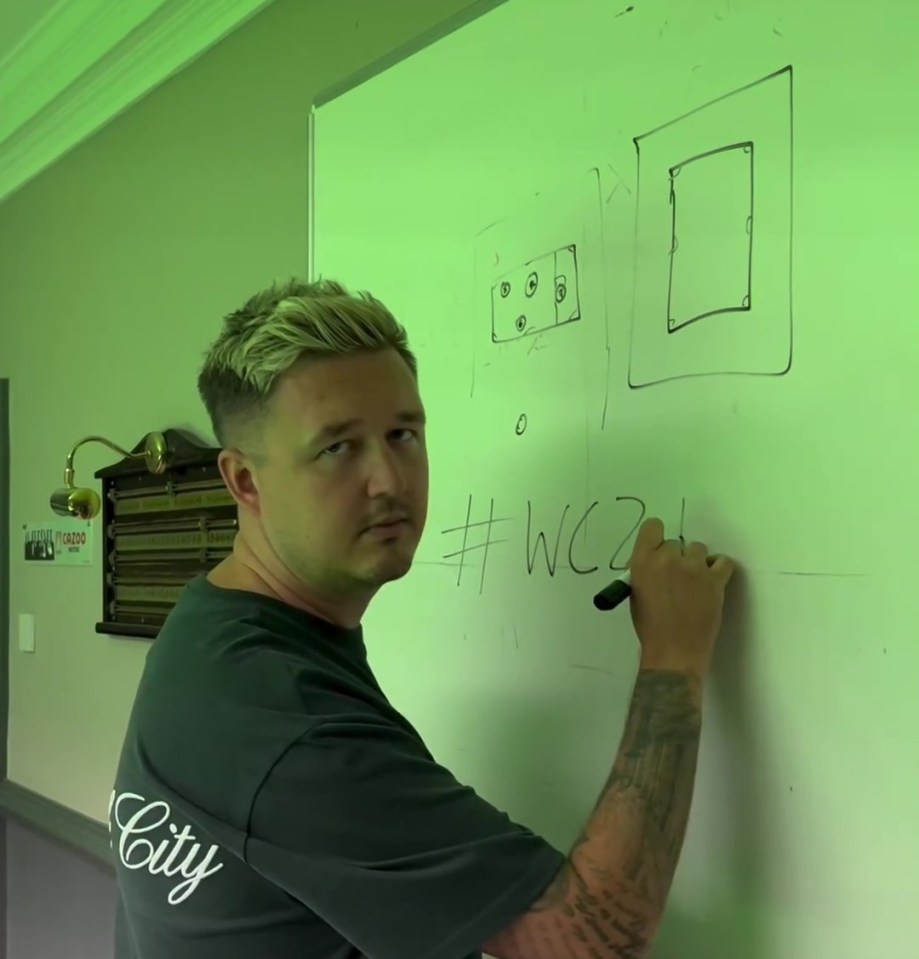 World champion Wilson wrote the '4' without looking to complete '#WC24' on the whiteboard