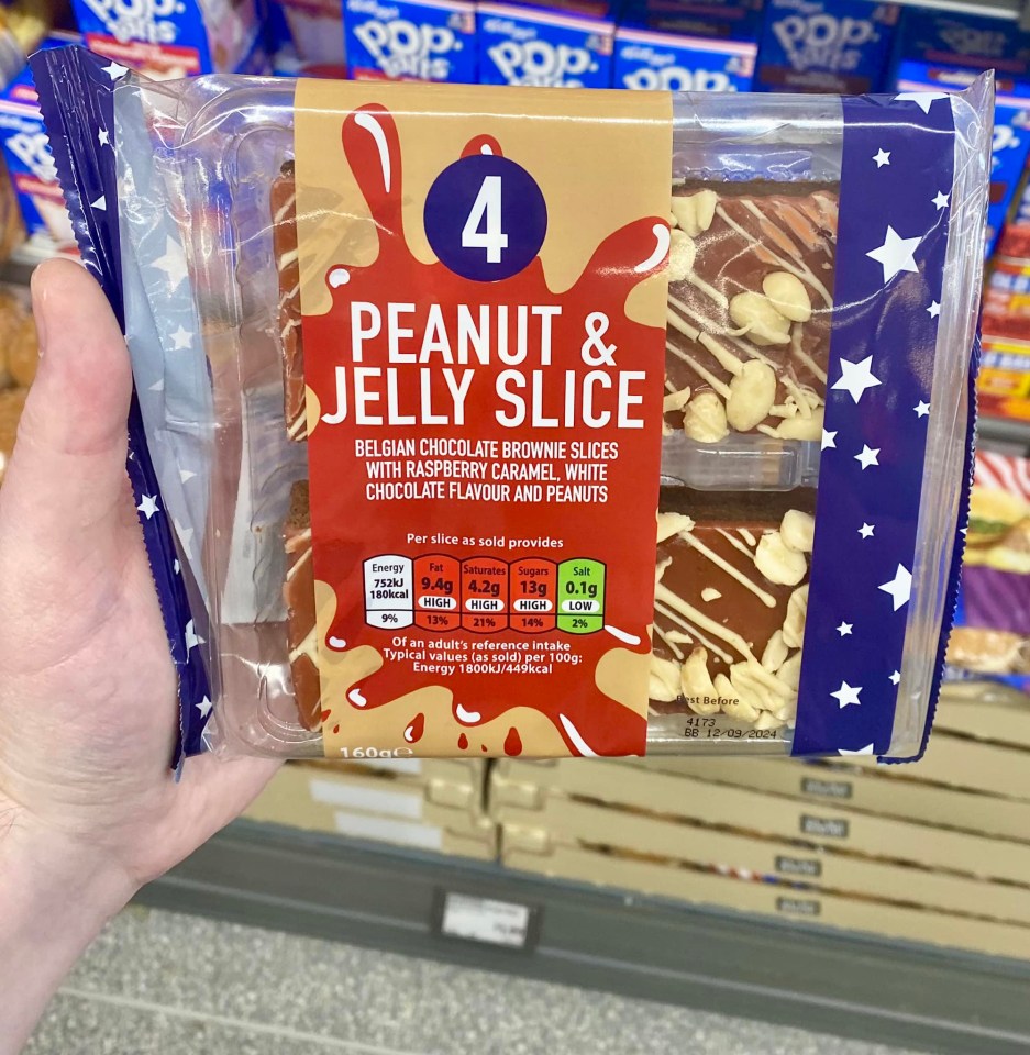 a person is holding a package of peanut and jelly slice