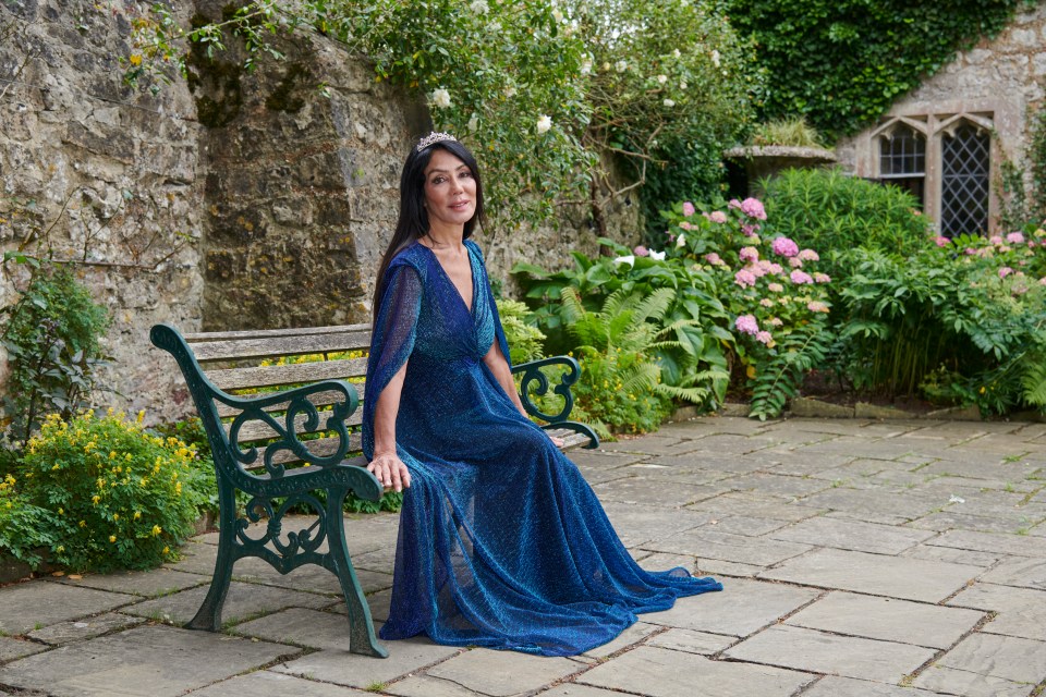 Ann in a charming walled garden in the grounds